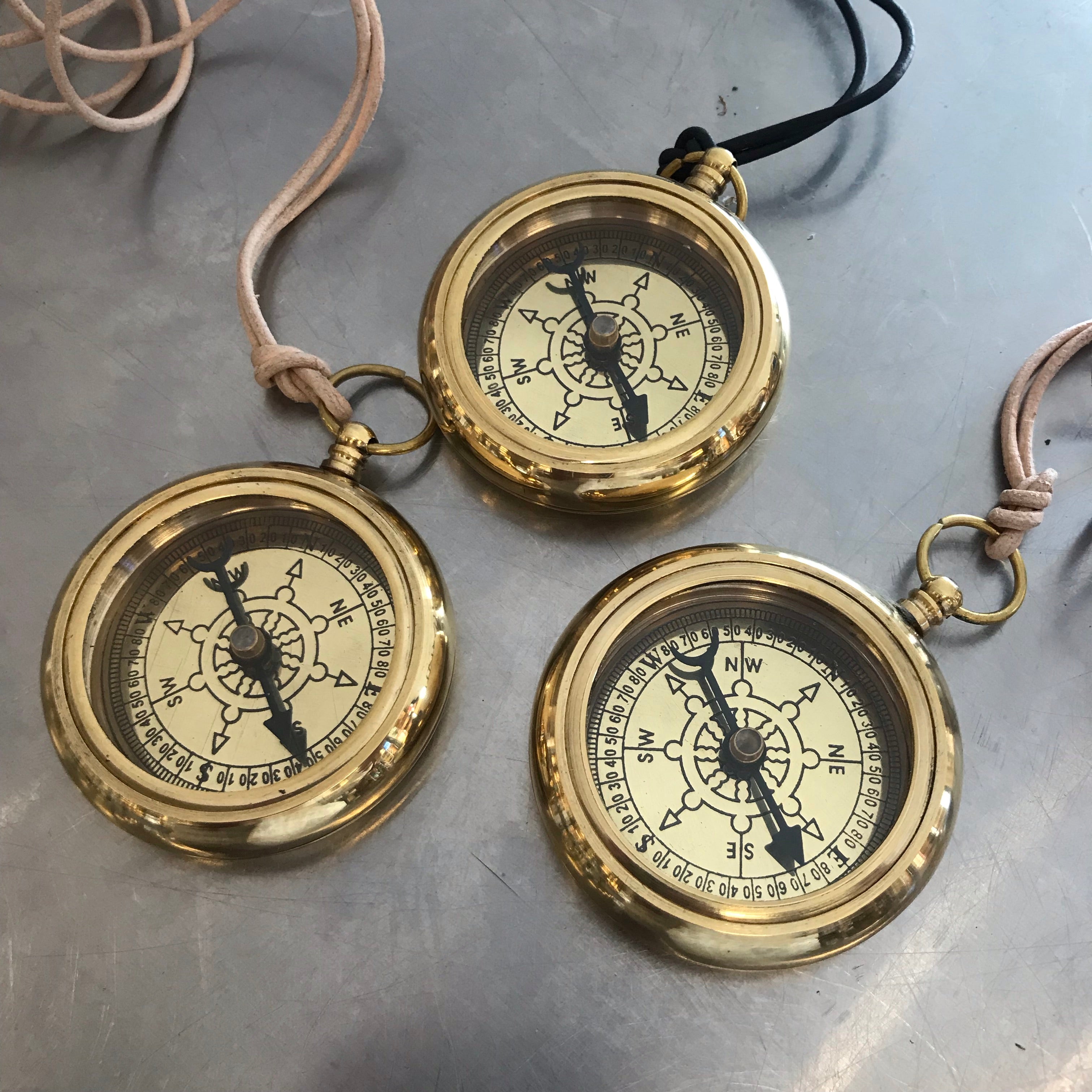 Jewelry, brass compass on leather